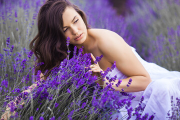 Close up portrait of beautiful young woman in lavender field.