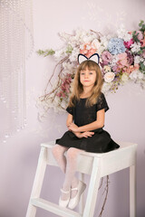 Little beautiful girl with cat ears. Copy space.