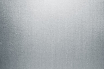 Silver paper texture background. Gray metallic paper sheet surface. Shiny cardboard with smooth...