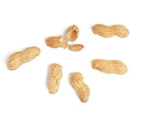 heap of peanuts in shell and broken, food isolated on white background