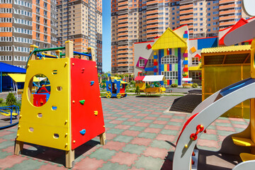 The children's playground in the yard of a new modern kindergarten among residential multi-storey buildings. Rostov-on-Don / Russia - 07 may 2019