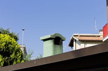 A little green chimney on the roof (Pesaro, Italy, Europe)