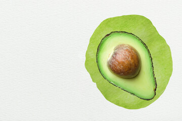 Raw ripe halved hass avocado with piton green watercolor splotch background. Creative food poster banner for vegan healthy oil diet concept