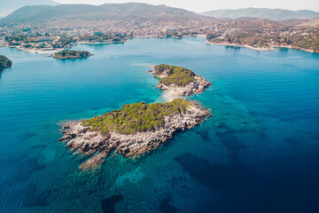 Fototapeta na wymiar Aerial view of the coastline of the resort town of Ksamil on a sunny summer day. Albania.