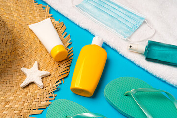 Sunscreen cream and protective mask. Coronavirus summer concept