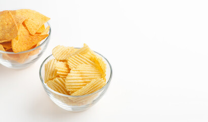 Dry snacks for beer. Corrugated chips and nachos in glass bowls