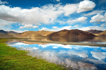 Landscape with reflections of the mountains on the lake named Pagong Tso, situated on the border with India and China.