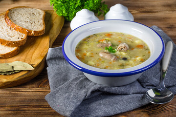 Polish barley soup with vegetables and chicken heart.