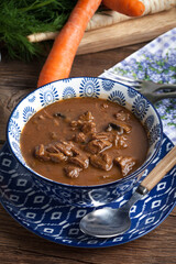 Goulash soup with pork and mushrooms.