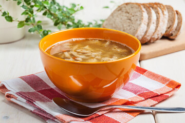 Traditional polish tripe soup with vegetables.