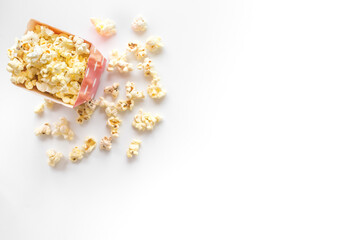 Top view of popcorn in cup on white background copy space