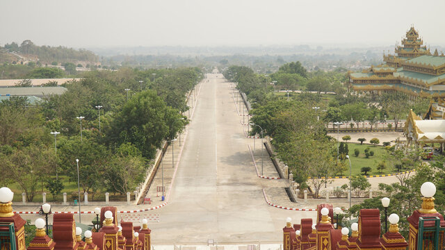 Empty highway road without traffic in Naypyitaw, the planned city capital of Myanmar / Burma.