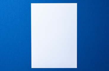 Blank paper business mock up on classic blue background