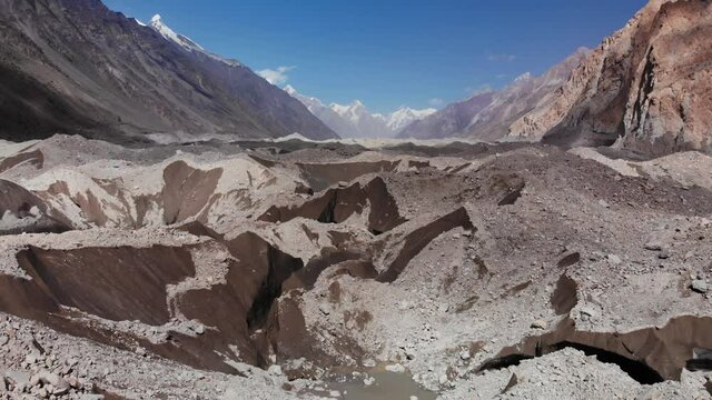 Backward moving view of the Batura glacier, 57 km in length, a beautiful morraine landscape near the Hunza valley in the Koarakorum range, Gilgit Baltistan region, Pakistan