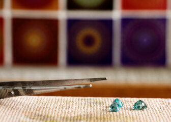 Different goldsmiths tools on the jewelry workplace. Desktop for craft jewelry making with...