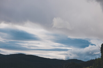 Naklejka na ściany i meble morning sky with beautiful clouds over the hills of Tasmania