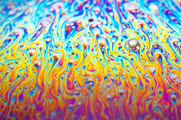 Beautiful psychedelic abstraction formed by light on the surface of a soap bubble