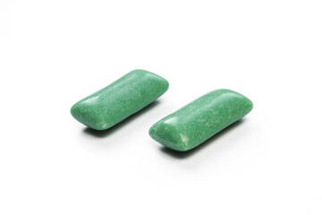 Two green mints isolated on white background. Sweet Chewing gums close-up