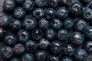 Fresh ripe blueberries with drops of water. Close up. Background.