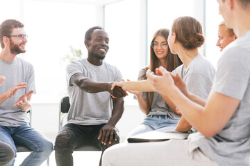 seminar participants shaking hands sitting in the conference room