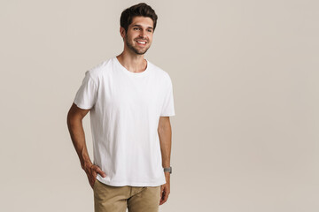 Portrait of cheerful handsome man smiling and looking aside