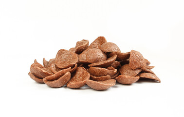 Pile of delicious chocolate cornflakes isolated on white background. Brown crispy flakes ready to eat
