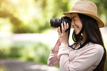 Photography Classes. Young Asian Girl Student Taking Photo Outdoors With Digital Camera