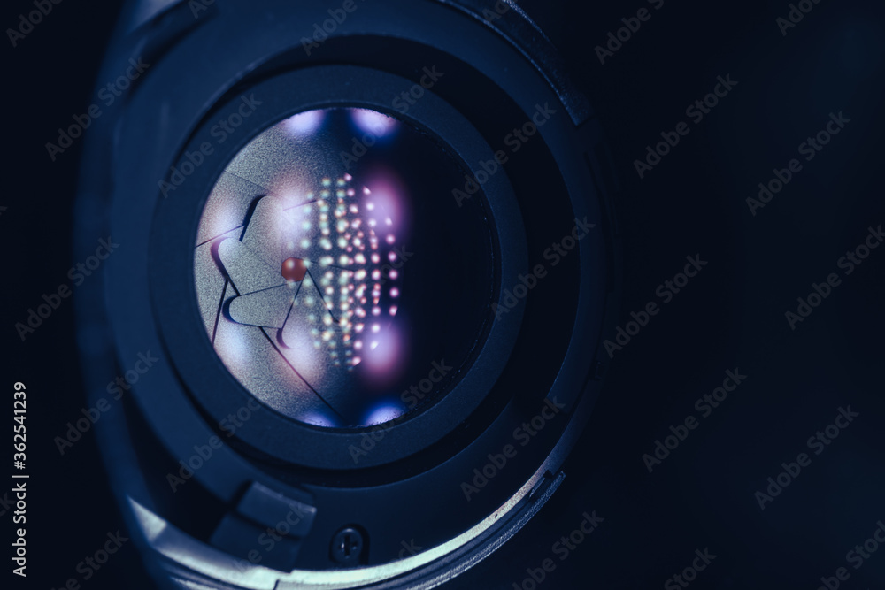 Aufkleber Close up Beautiful Camera Lens on a dark with red reflection light background. Macro view.