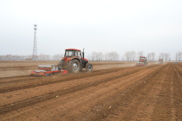 seeder sows in the field, North China