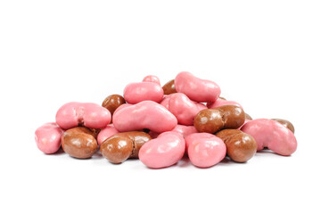 Pile of peanut flips covered with chocolate isolated on white background.Mixed  Pink/Strawberry and milk chocolate coating