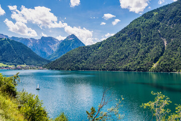 Fototapeta na wymiar Beautiful view on Achensee, Achen Lake. Pertisau, Alps in Tyrol, Tirol, Austria