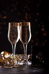 selective focus of glasses full of champagne against christmas lights