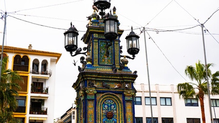 Fototapeta na wymiar monumental fountain at the centre decorated with Seville ceramics located on Plaza Alta in Algeciras Spain