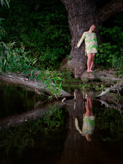 girl by the old oak tree by the lake