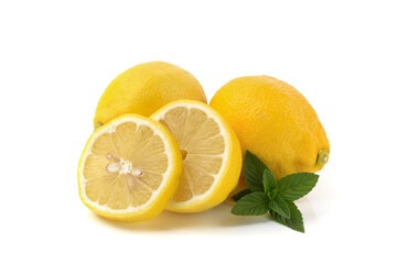 lemons whole and sliced, mint leaves, close-up on a white background, text space, horizontal view