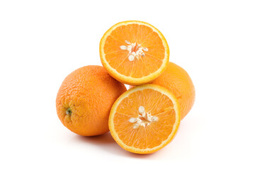 three oranthree oranges, whole and cut with splashes of juice close-up on a white background, horizontal viewges close-up on a white background, horizontal view