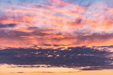 Colorful clouds after rain at sunset time.