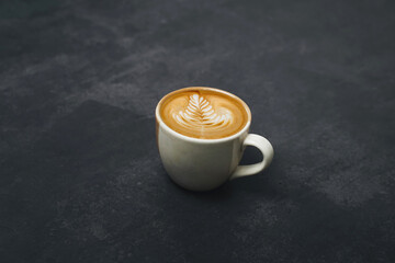 Coffee cup and beans on old kitchen table. Top view with copyspace for your text