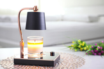 The luxury lighting aromatic scent  glass candle is put on the electric lamp candle warmer heater...