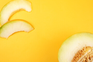 Juicy slice melon on a yellow background. Food concept. Healthy eating. Copy space for design.