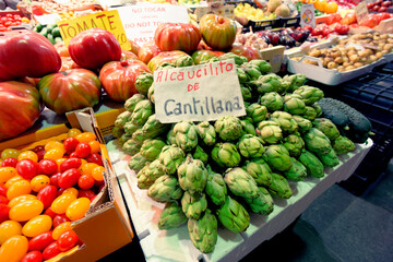Fresh artichokes on farm market in Spain, toned