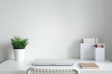 Workspace with white table and laptop, minimalism workplace interior, nobody