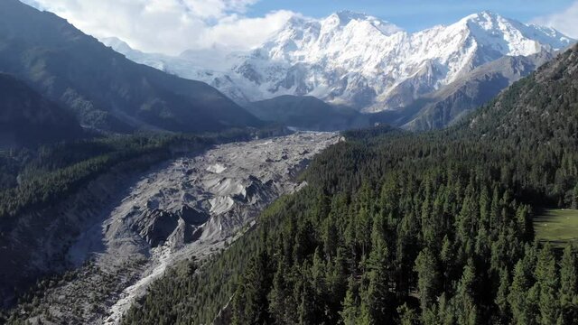 Breathtaking rotating view of Nanga Parbat mountain with its Rakhiot morraine glacier, snowy peak and blue sky, in the northern areas of Pakistan, trekking travel destination