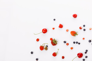 Fresh summer berries, strawberries, raspberries, blueberries, cherries on a white background