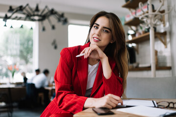 Smiling young woman working in cafe