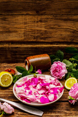 Ingredients for cooking rose petals jam. Sugar, lemon, fragrant flowers