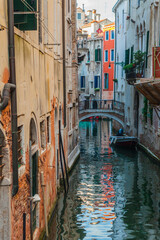 Naklejka na ściany i meble Venetian Canal Passing Through Buildings