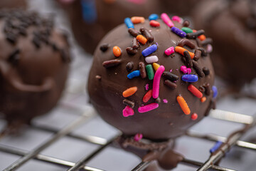 Chocolate donut holes with sprinkles