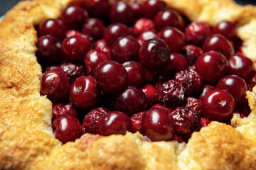 Close-up filling of cherries for galettes. Open pie filling texture.
