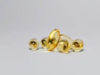 Close up of capsules Omega 3 or fish oil capsules isolated on white background. Healthcare concept